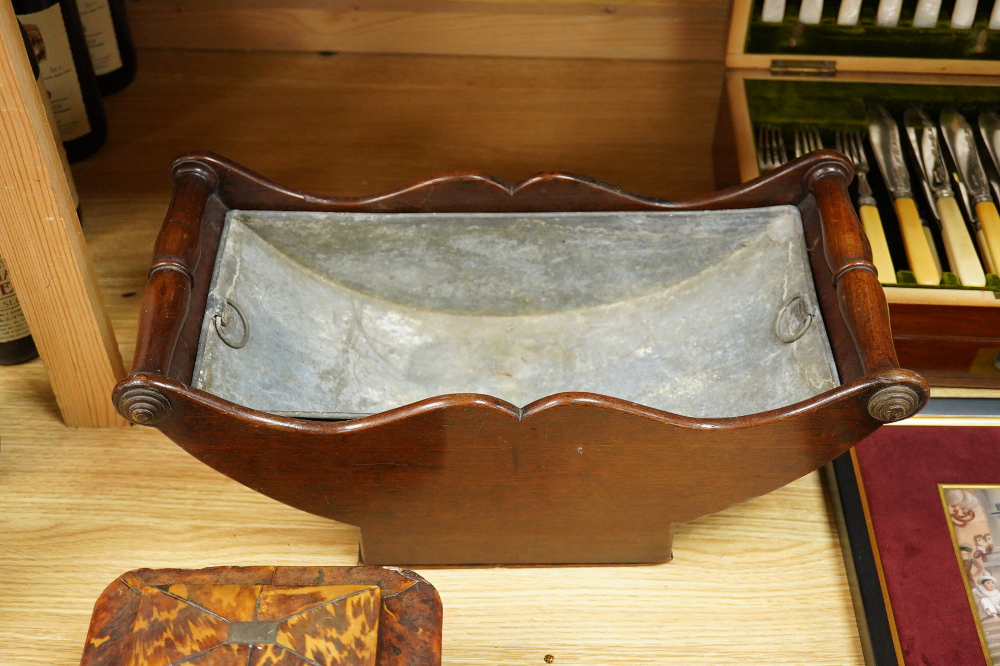 A Regency tortoiseshell tea caddy (damaged) and a mahogany cheese coaster, 43cm wide